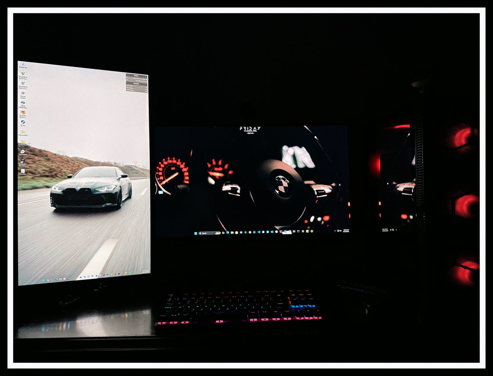 Night driving scene on a dual-monitor desk setup