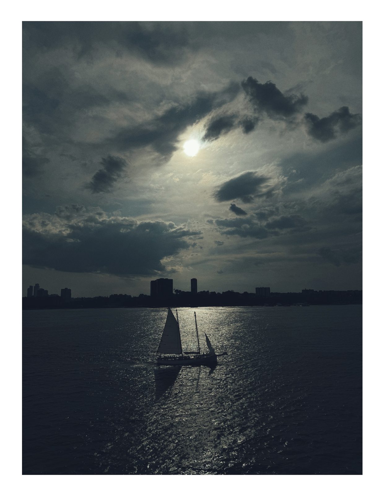 Sailboat silhouette on the Hudson at dusk